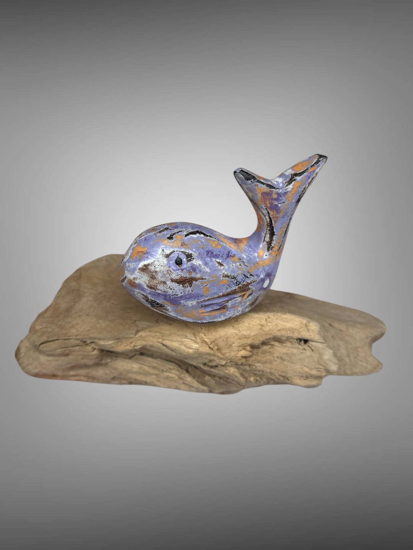 Wooden carved painted whale on wood stand